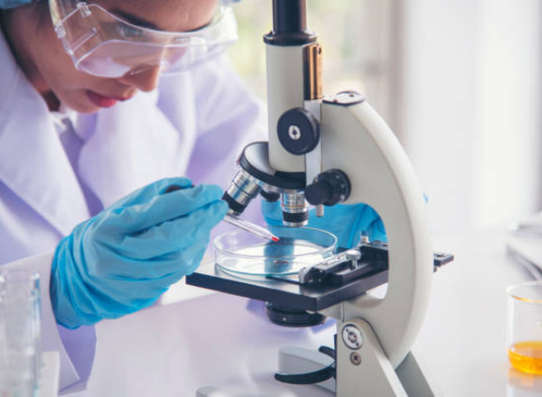 Woman scientist in lab look at science microscope medical test and research biology chemistry. Females technician laboratory analyzing scientific pharmacy genetic research. Chemistry Medical test lab